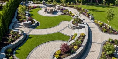 Intricate hardscaping in Surrey with paver pathways, a circular patio, and multi-level garden walls.