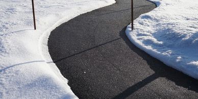 A perfectly cleared commercial sidewalk in Surrey after professional snow blowing and shoveling