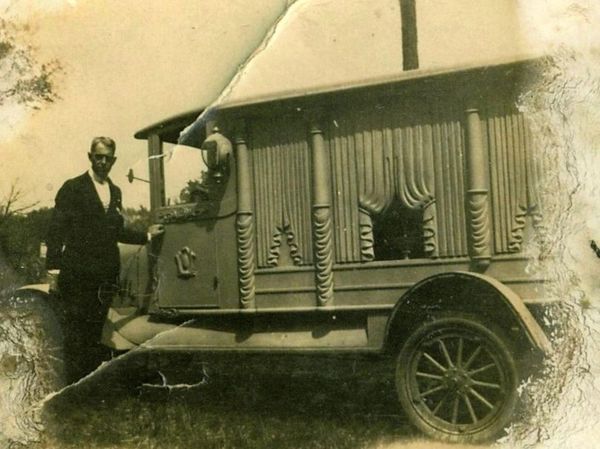 Carl Schubert and his hearse, 11920s