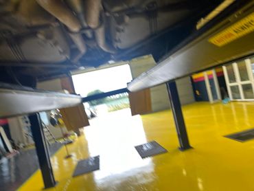 MOT ramp holding a Bentley continental GTC with custom stainless exhaust