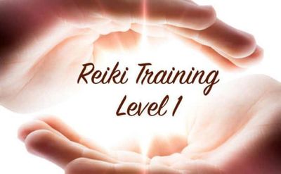 Hands surrounding glowing light with Reiki Training Level 1 text.