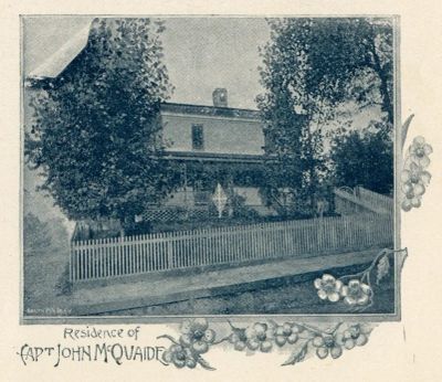 Historic residence of Capt John M Quaide with wooden fence.