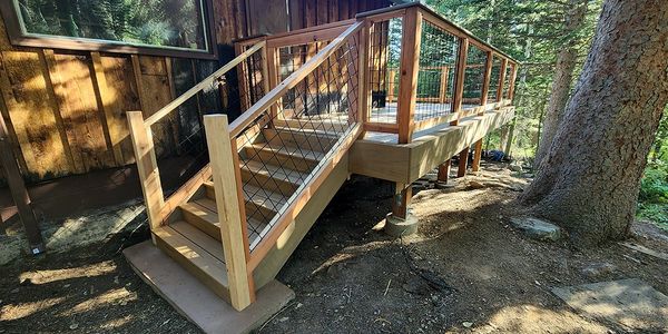 TimberTech deck with redwood posts & rails, with hogwire panels.