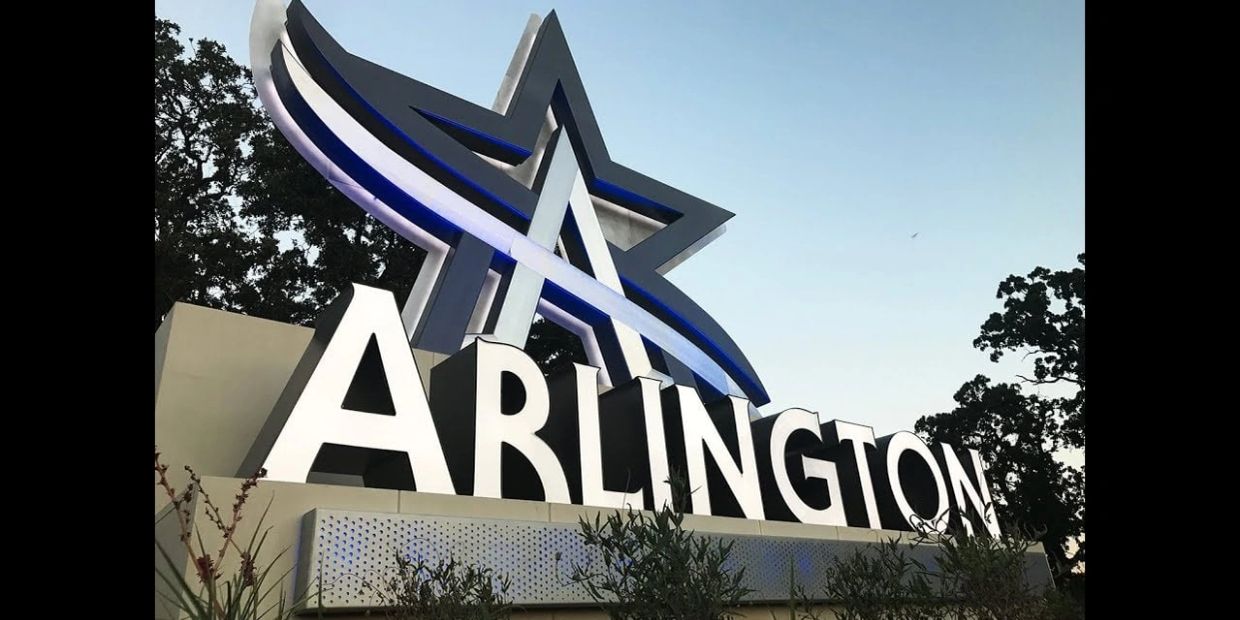 Arlington sign with a star symbol at dusk.