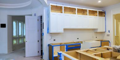 Turnkey kitchen remodeling project in progress with custom cabinet installation.
