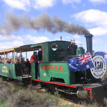 red cliff steam train with australia flags blue sky