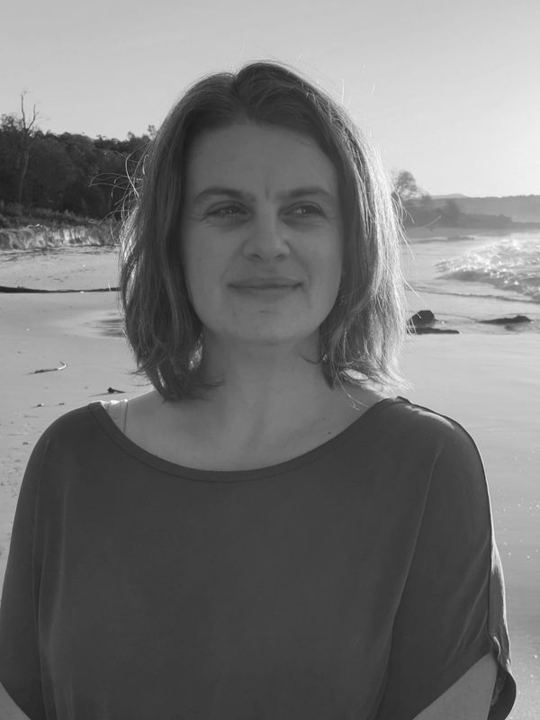 Emma relaxing on a beach in the afternoon sun.
