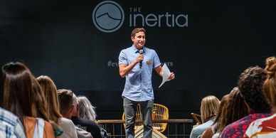 Zach Weisberg welcomes the crowd to EVOLVE: Celebrating Good Vibes in Surf Culture.