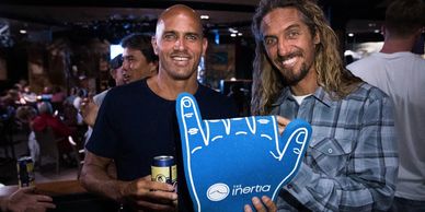 Kelly Slater and Rob Machado share a high five at The Inertia's HI-5 world premiere.