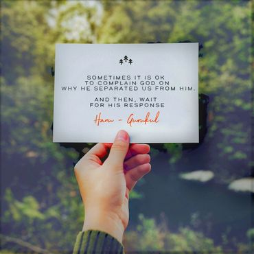 Hand holding a card with a spiritual quote about patience and faith in God.