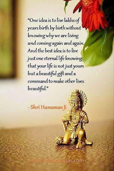 Inspirational quote by Shri Hanuman Ji with a small statue and flower.