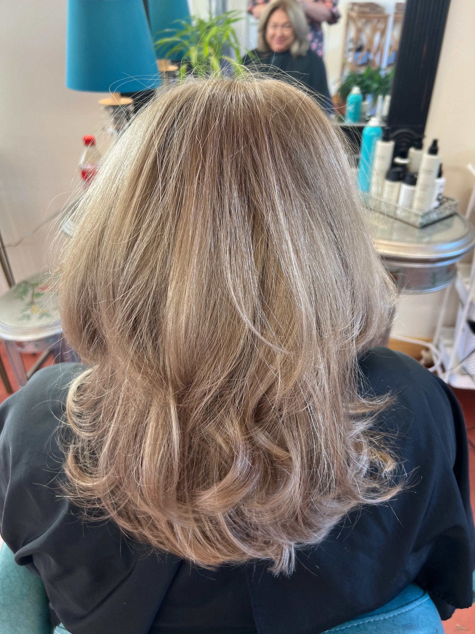 Grey hair color blending with long layered haircut