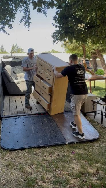 Spotless Solutionss LLC Loading up furniture items into trailer from clients property in Phoenix AZ.