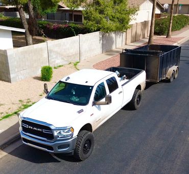 Drone photo of Spotless Solutionss LLC hauling junk and debris in Phoenix, AZ. Professional junk rem