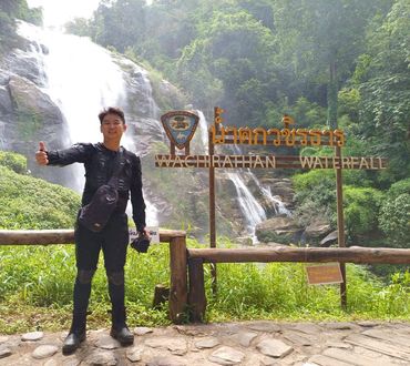Happy customer outside Wachirathan Waterfall.