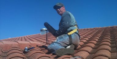 Bat Removal employee on a hot roof in Melbourne Florida