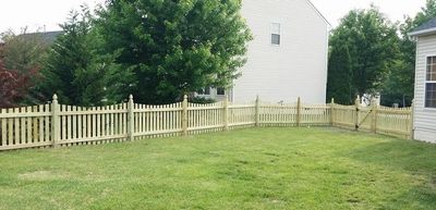 4’tall pressure treated spaced wood scalloped fence