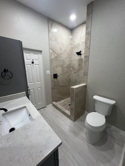 Bathroom remodel completed in Murphy, TX. This bathroom was a half bath that was converted into a fu