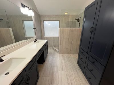 Bathroom remodel project completed in Wylie, TX. Bathroom renovation included new vanity cabinets, t