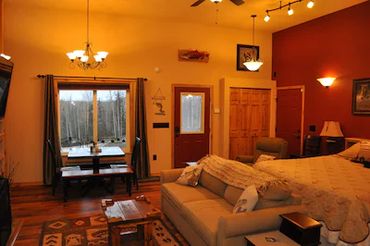 a beautiful bedroom with open window and lights on