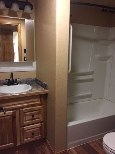 View of a bathroom in a house with a bathtub