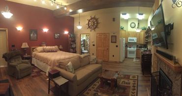 a spacious hall with an attached kitchen