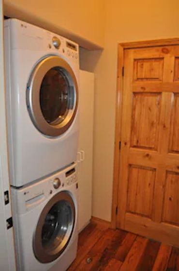 Two washing machines and a door