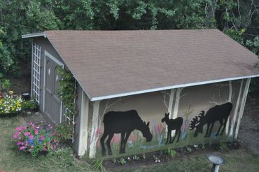 a small hut with animals painted on it