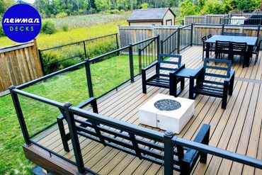 Floor level TREX composite deck with glass aluminum railings.