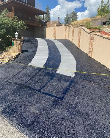 Sealcoating and crack filling a driveway with heated concrete