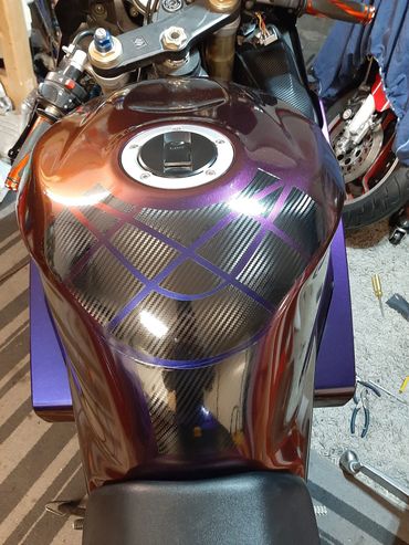 Custom designed carbon fibre vinyl tank pad