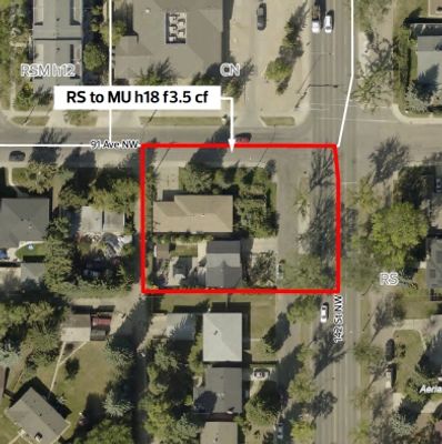 Aerial view of a residential area with a marked property boundary in red.