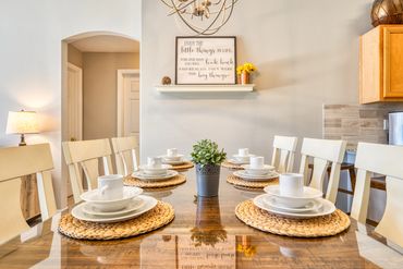 Disney Lillian House eating area with Enjoy the little things sign