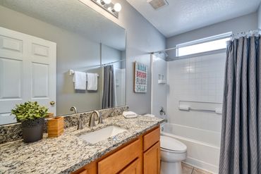 Disney Lillian House hall bath with shower, tub, large vanity