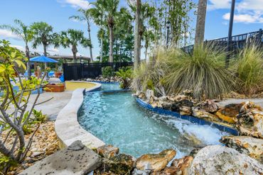 Terra Verde Resort stream and hot tub and pool with palm trees