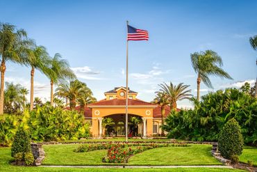 Terra Verde Resort landscape, palm trees and United States Flag
