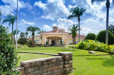 Terra Verde Resort Clubhouse, palm trees and landscape.