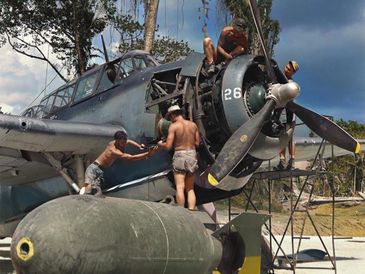 TBF-1 being repaired at Bougainville in 1944 with a 2,000 pound AN-M66 bomb in the foreground.