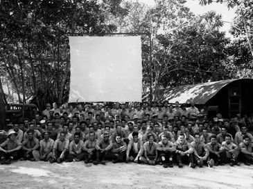 August 1943 VT-21 combat crew photo at their Lunga Beach, Guadalcanal campsite at tours end.