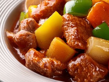 Close-up of a savory beef stew with colorful vegetables.