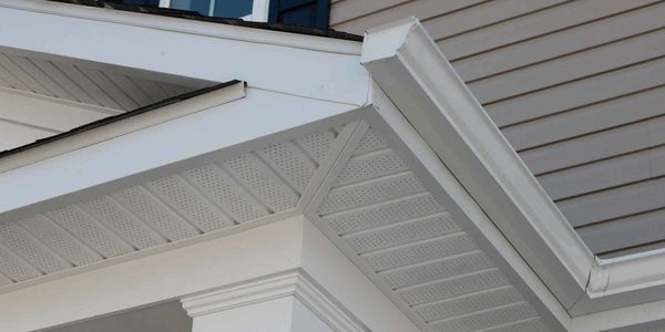 white soffit on a residential home in York County, PA color matched with seamless rain gutters