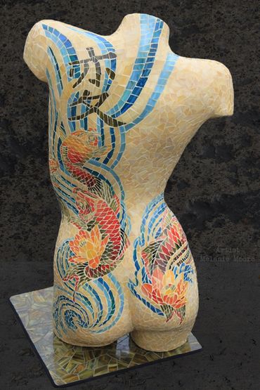 Mannequin mosaic torso art.