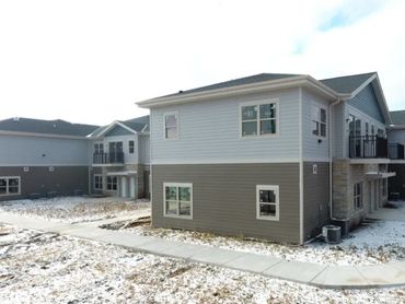 Rear Right view of Snow cleared sidewalks