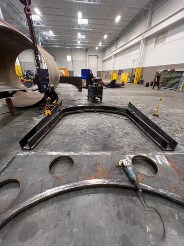 Trench box spreaders