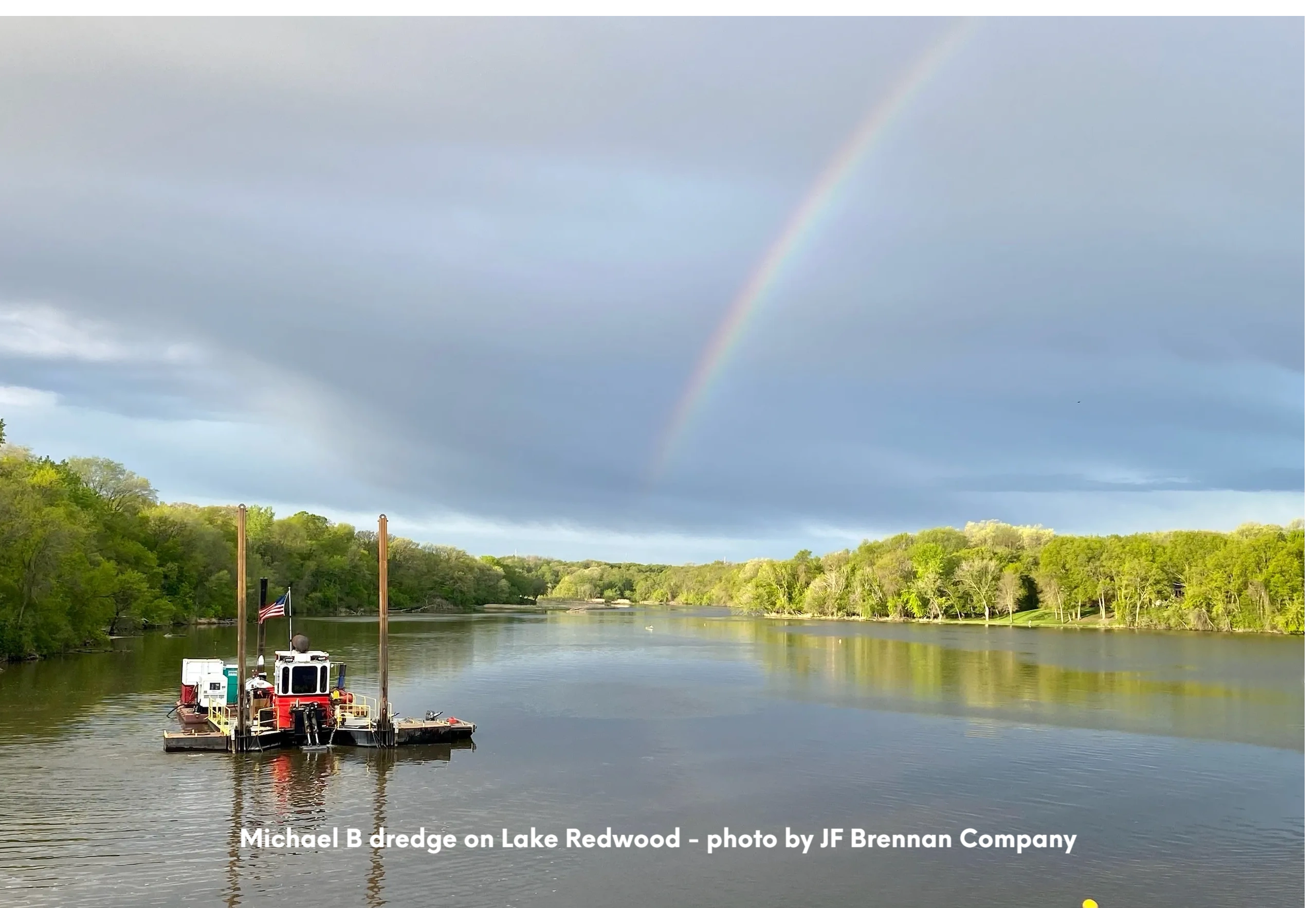 Picture of Michael B dredge on Lake Redwood with a rainbow.
