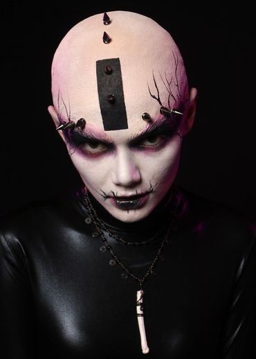 A Harkonnen Harpy from the world of Dune dressed up for a club night