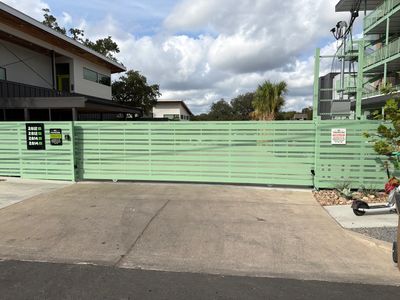 Metal fence and gate opener