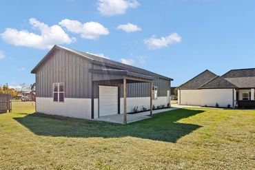 24x52 garage metal siding and roofing, garage doors, wood framing, porches