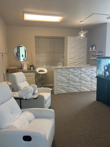 Inside Pure Hydration Chico viewing reception desk and patient chairs.