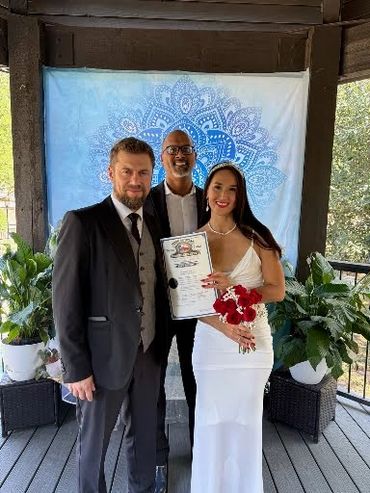 Dennis with Anastasiia and Maksym after their wedding ceremony.
